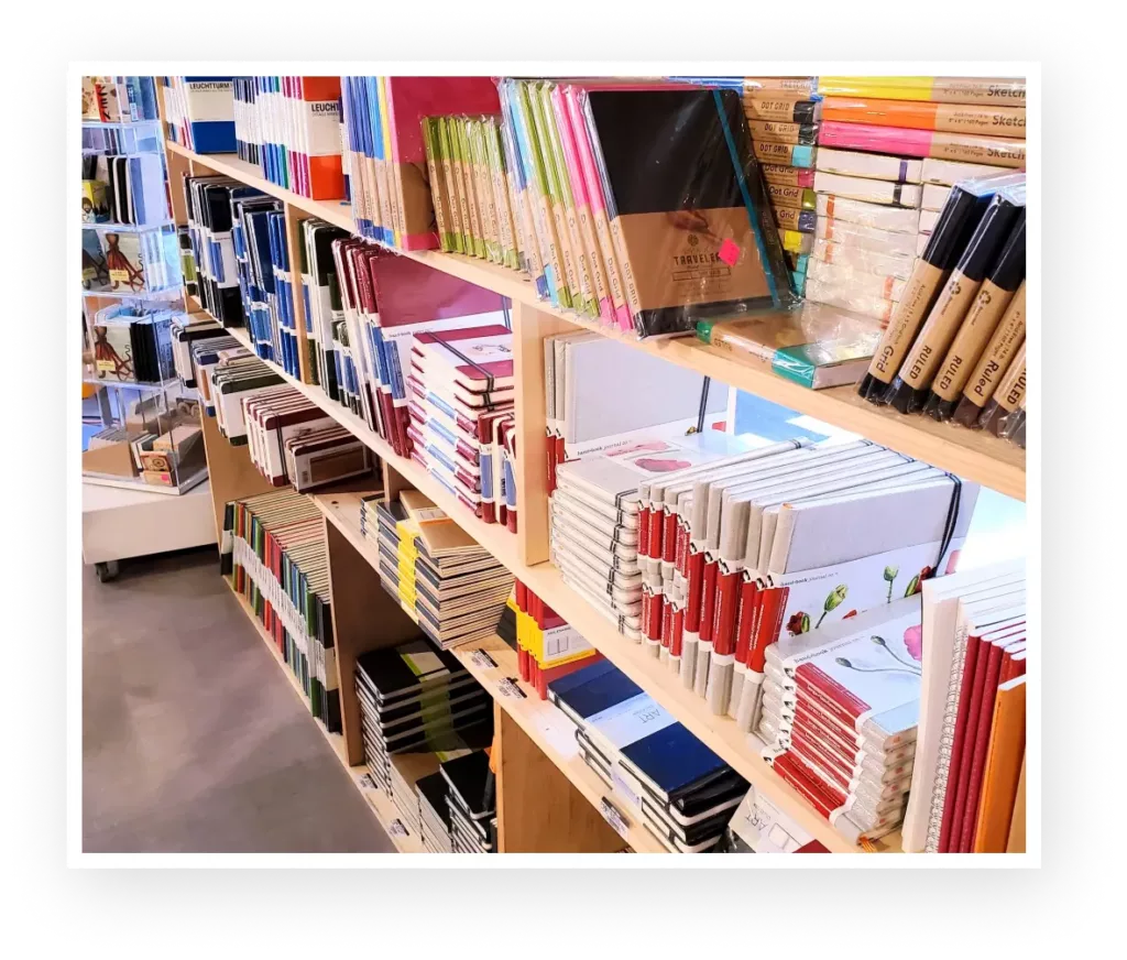 Notepads and art supplies on Shelves in an Arts and Crafts Store. Notepads and art supplies on Shelves in an Arts and Crafts Store.