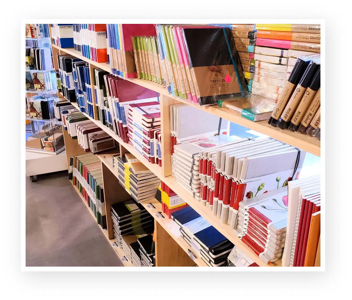 Notepads and art supplies on Shelves in an Arts and Crafts Store.